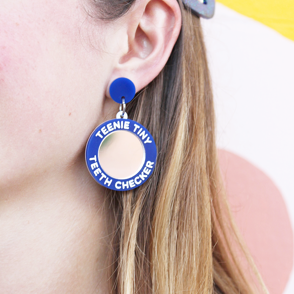 woman wearing things by bean teenie tiny teeth checker earrings in blue - cocoandduckiemart.com