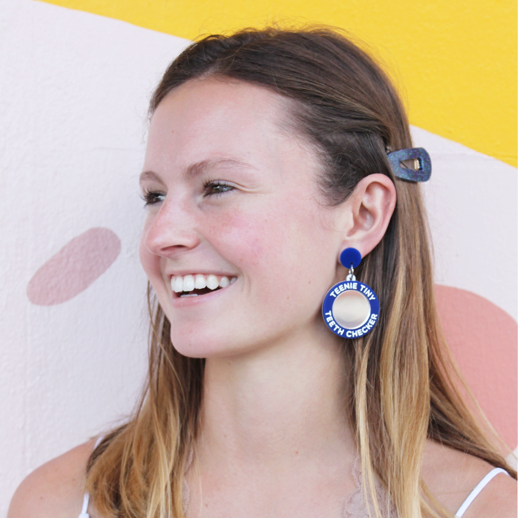 woman wearing things by bean teenie tiny teeth checker earrings in blue - cocoandduckiemart.com