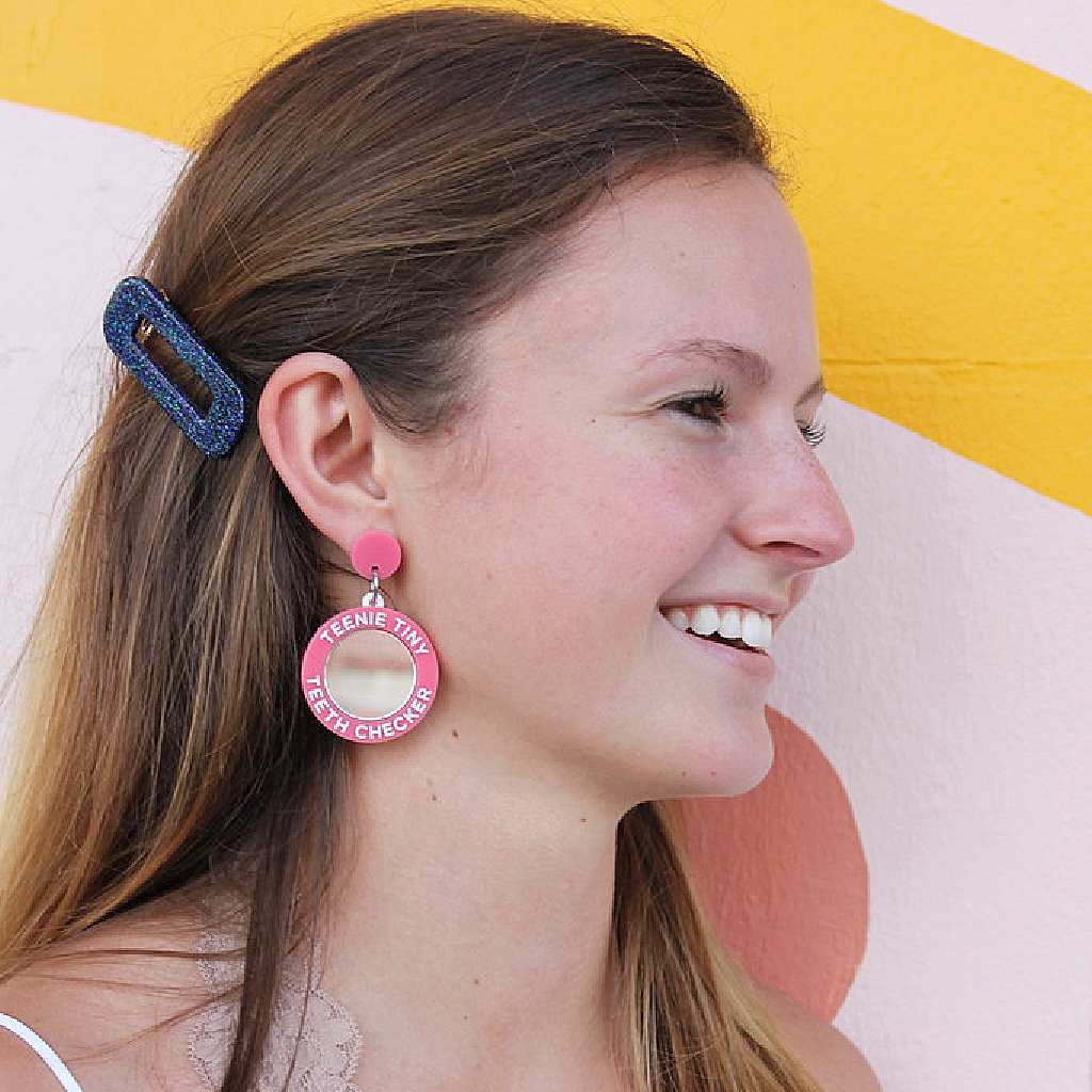 woman wearing things by bean teenie tiny teeth checker earrings in pink - cocoandduckiemart.com