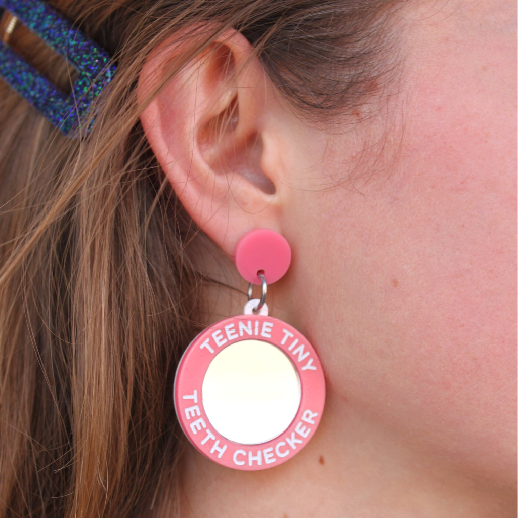 woman wearing things by bean teenie tiny teeth checker earrings in pink - cocoandduckiemart.com